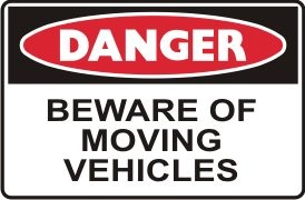 BEWARE OF MOVING VEHICLES