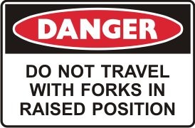 DO NOT TRAVEL WITH FORKS IN RAISED POSITION FORKLIFT