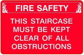 THIS STAIRCASE MUST BE KEPT CLEAR OF ALL OBSTRUCTIONS
